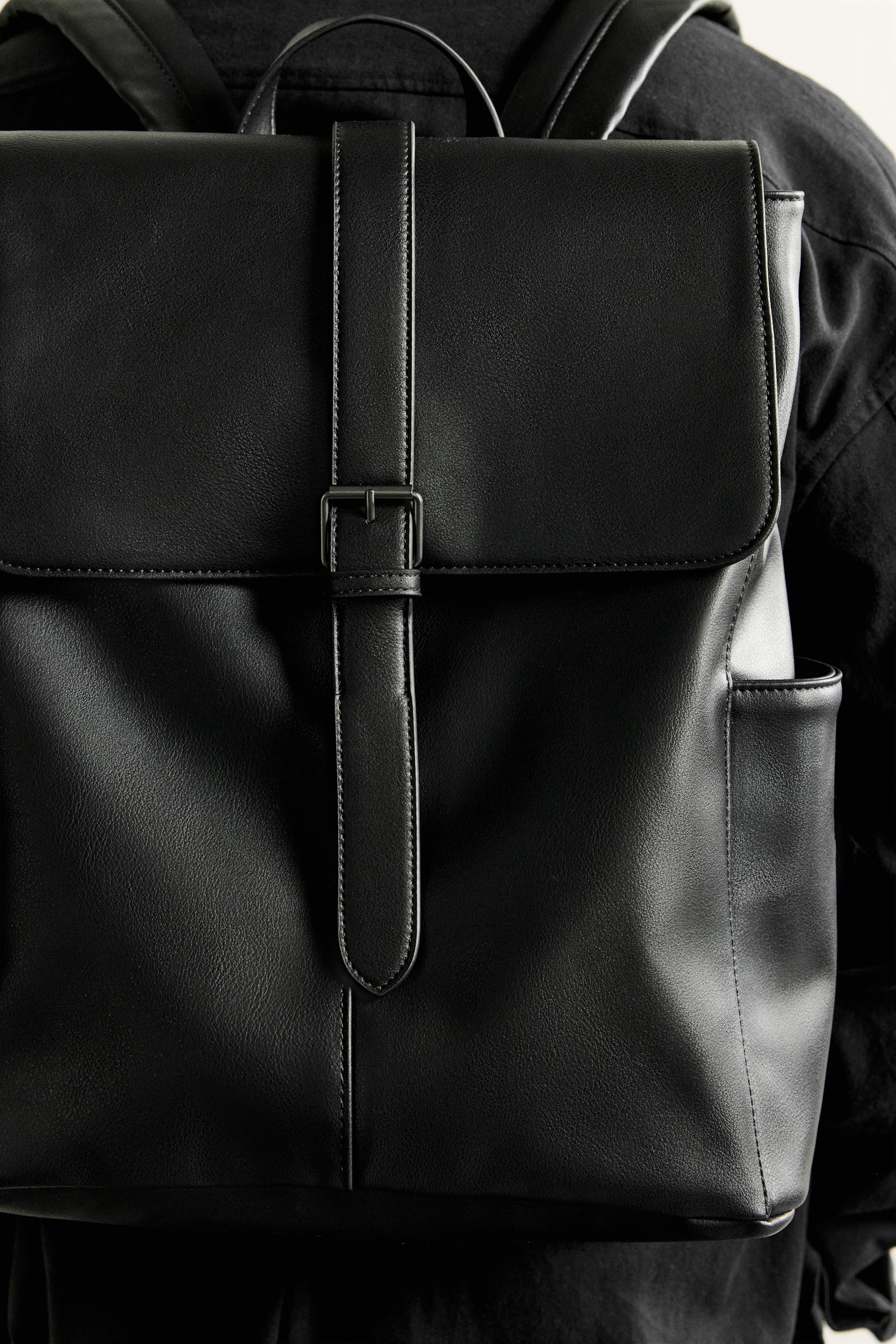 BELTED FLAP BACKPACK